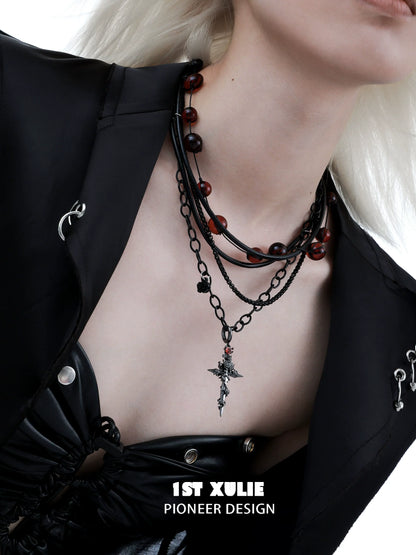 Stylish gothic cross necklace layered with beads for a unique fashion statement
