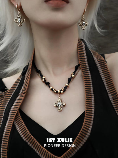 Gothic cross necklace from 1STXULIE with matching earrings and intricate design