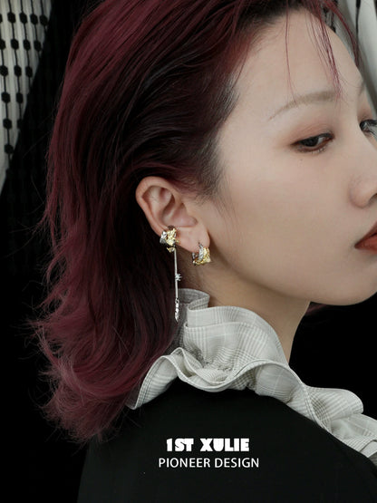 Gothic demon feather earrings featuring unique design and intricate details worn by a model