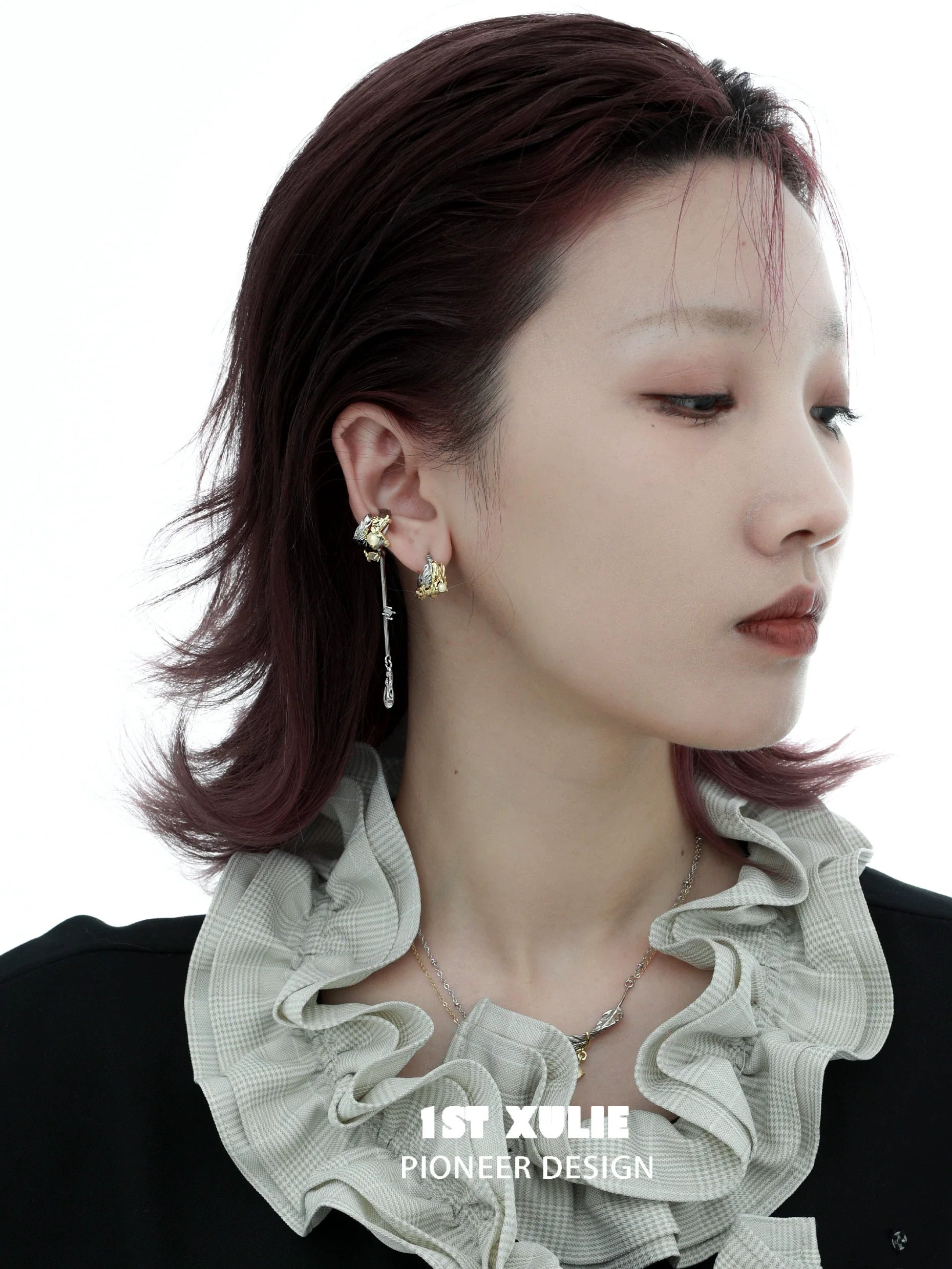 Gothic demon feather earrings by 1STXULIE showcasing a unique design worn by a model
