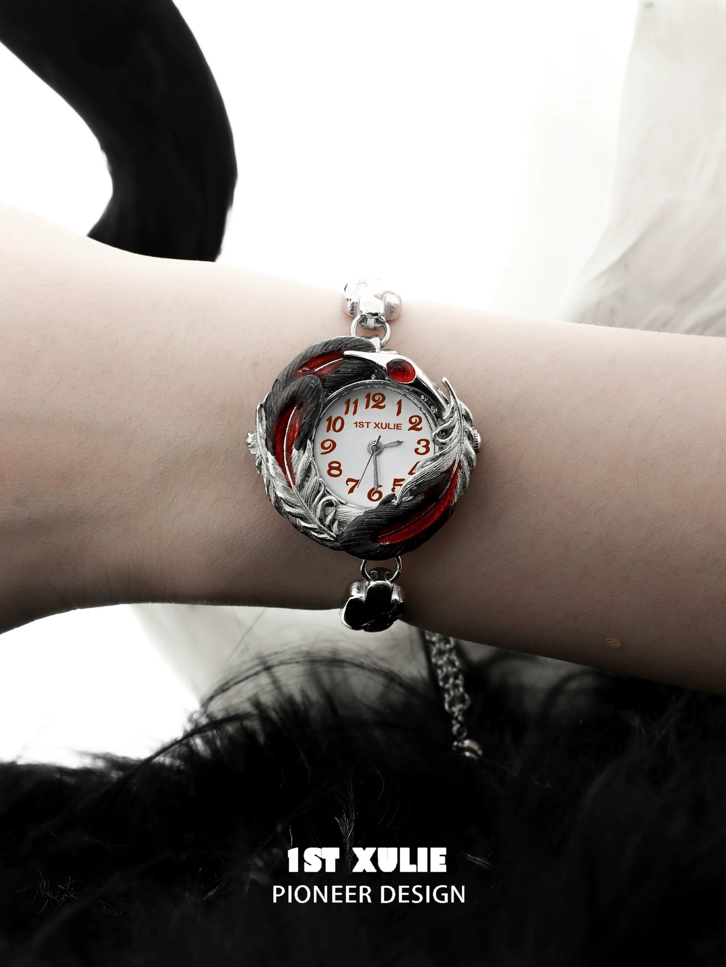 1STXULIE gothic feather bracelet with silver accents and stylish red details