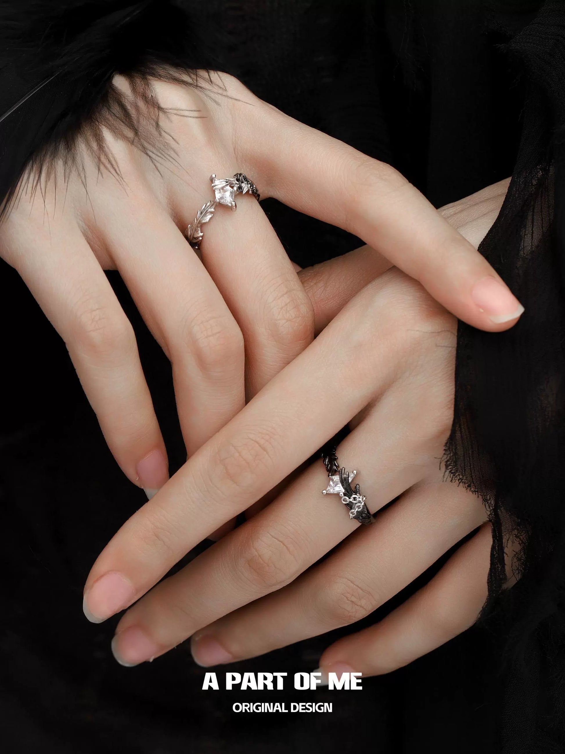 A PART OF ME gothic feather ring worn on fingers, showcasing its intricate design and craftsmanship