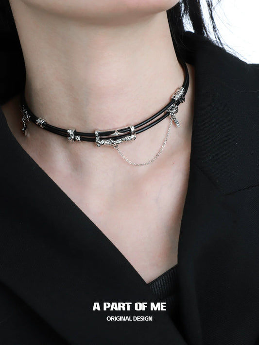 Gothic leather necklace with silver charms and layered chains for a unique style statement
