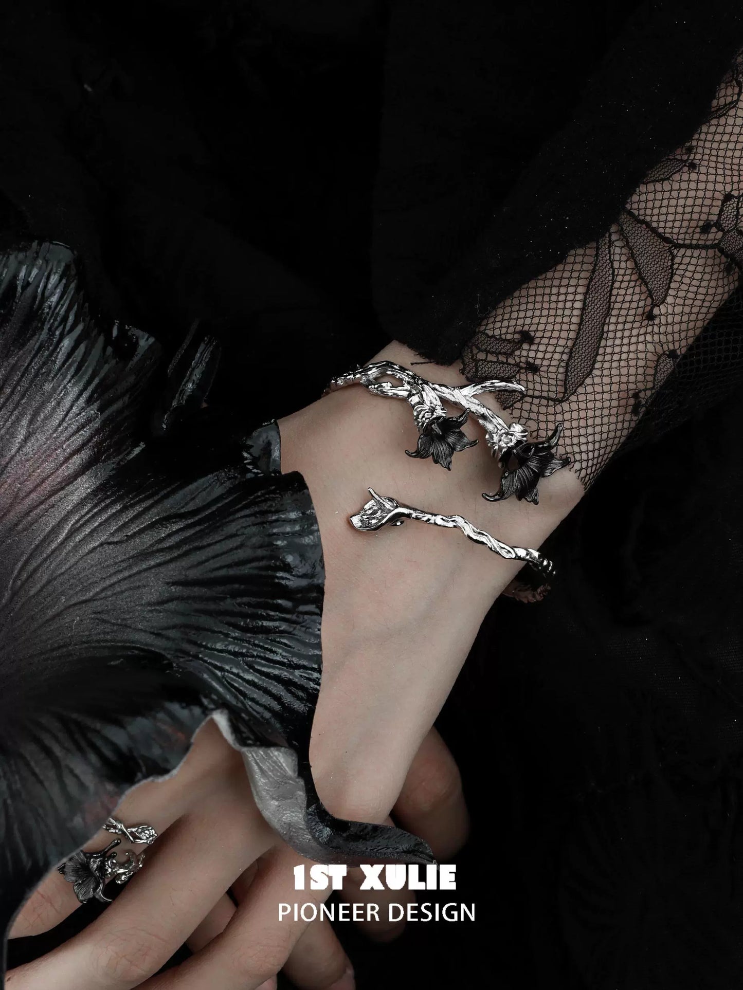 Gothic mandala bracelet featuring intricate designs on a hand adorned with jewelry