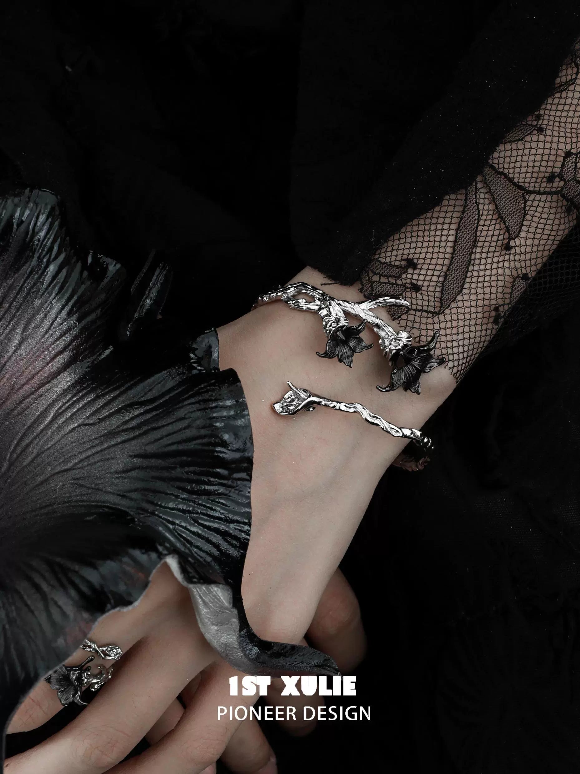 Gothic mandala bracelet featuring intricate designs on a hand adorned with jewelry