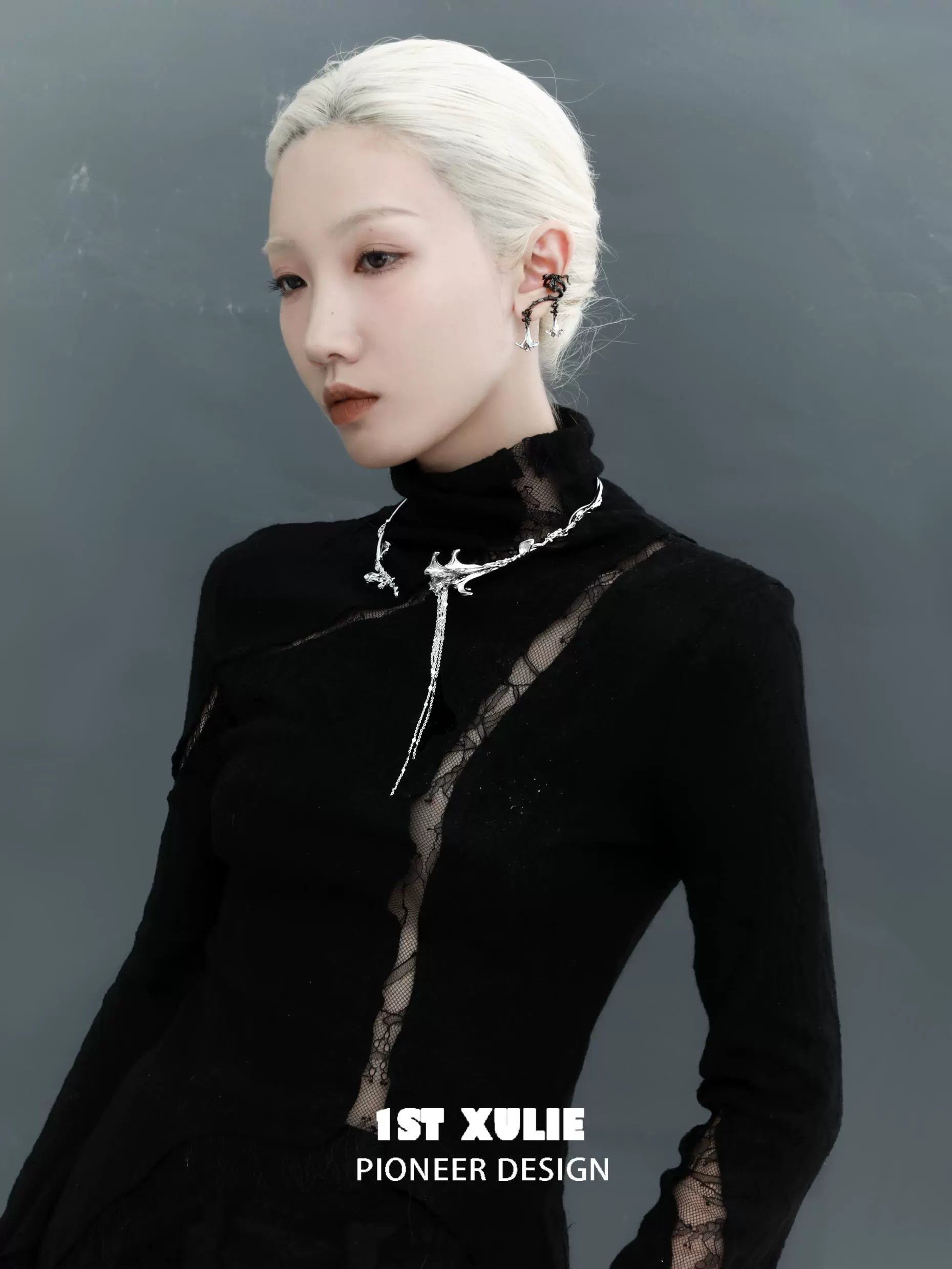 Stylish model wearing gothic mandala ear cuffs with an elegant black outfit and sleek hairstyle