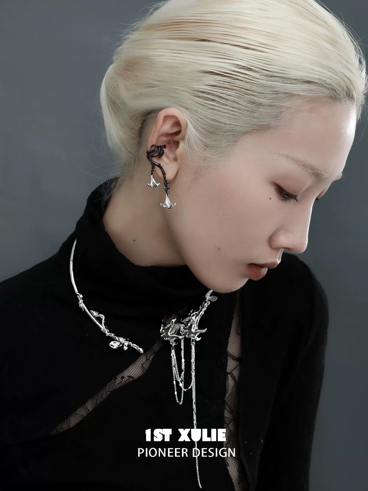 Model wearing a gothic mandala necklace featuring intricate silver designs, styled with dark attire