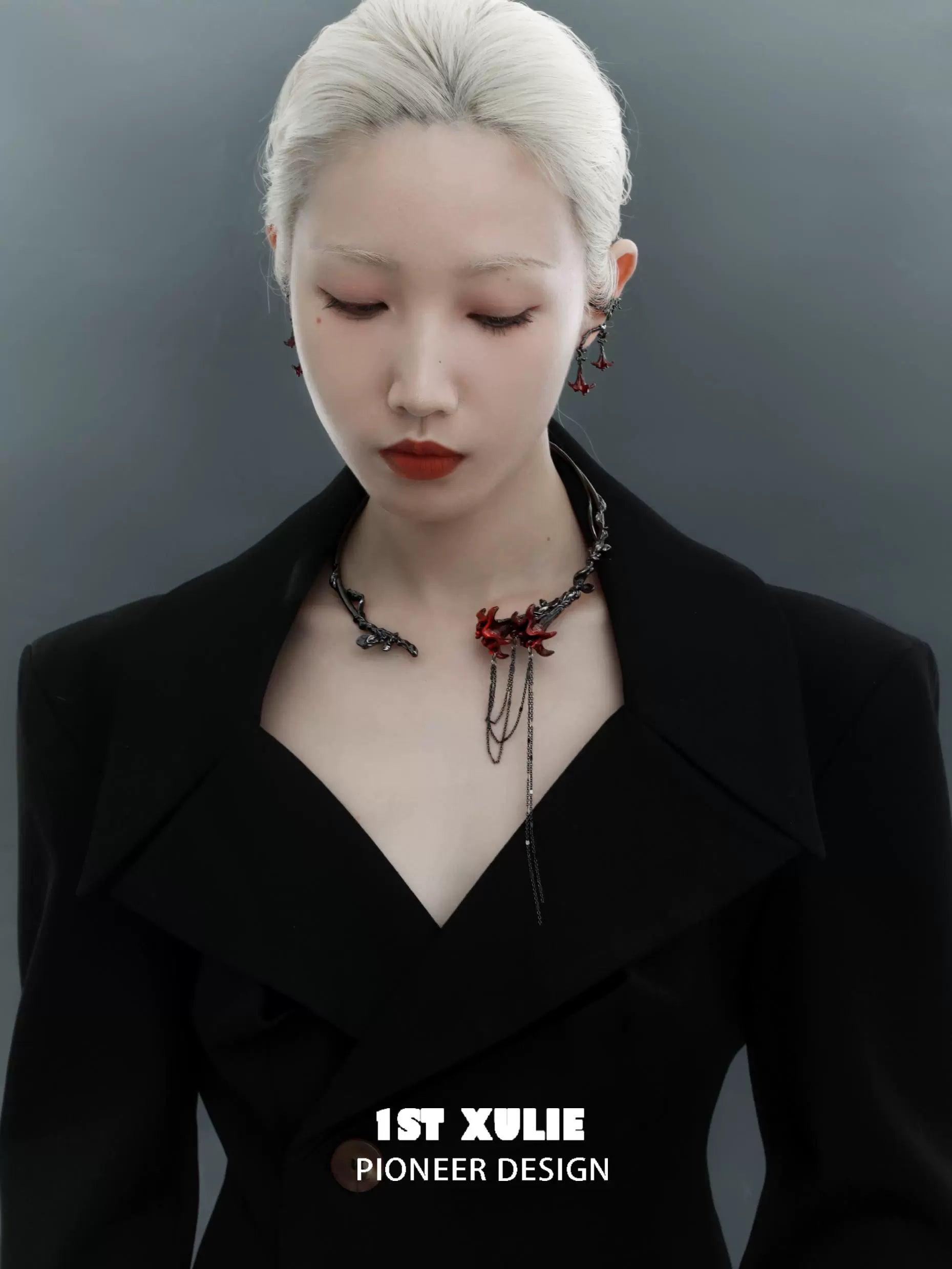 Elegant gothic mandala necklace with intricate designs worn by a model in a stylish black outfit