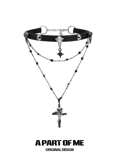 A PART OF ME gothic raven cross necklace featuring layered chains and detailed charms for a unique look