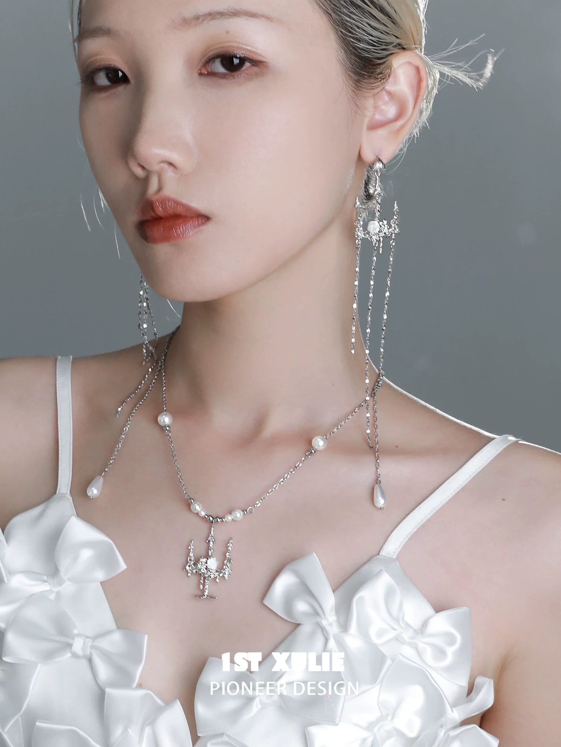 Model wearing gothic rose tassel earrings, showcasing a unique and elegant design with silver accents