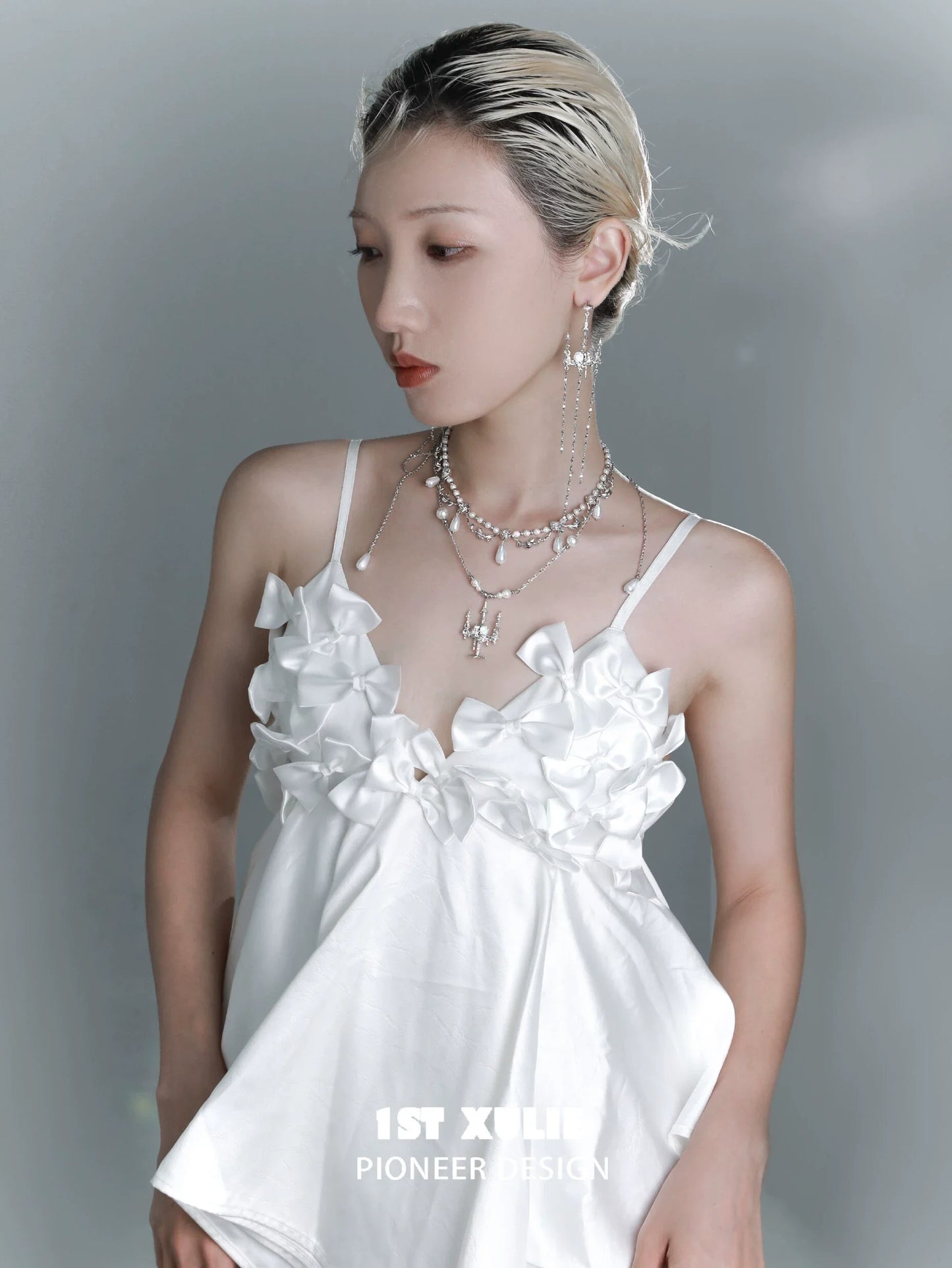Gothic rose tassel earrings showcased on a model wearing a stylish white top