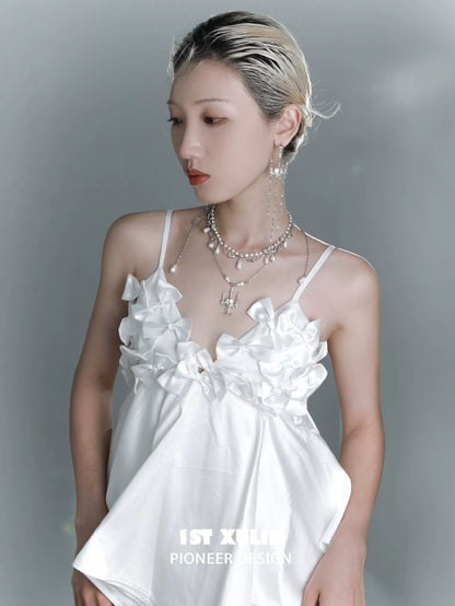 Gothic rose tassel earrings showcased on a model wearing a stylish white top