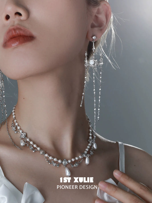 Elegant gothic rose tassel earrings in silver with sparkling gemstones for a dramatic look