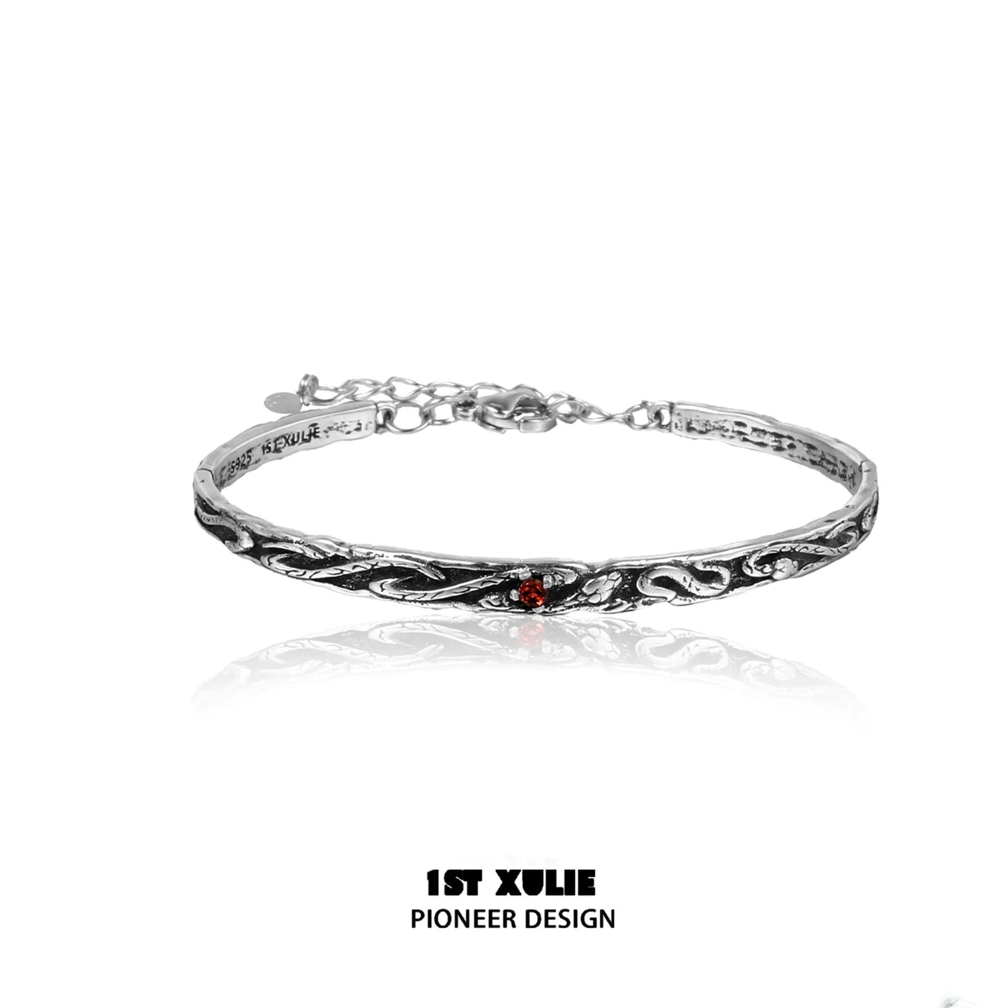 Gothic snake bracelet in silver with intricate design and red gemstone accent for unique style