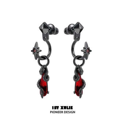 Gothic snake earrings designed by 1STXULIE featuring red accents and star details.