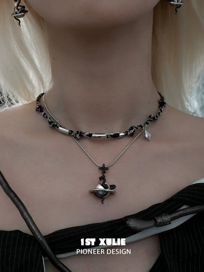 Gothic snake necklace featured in layered silver design with elegant detailing and charm