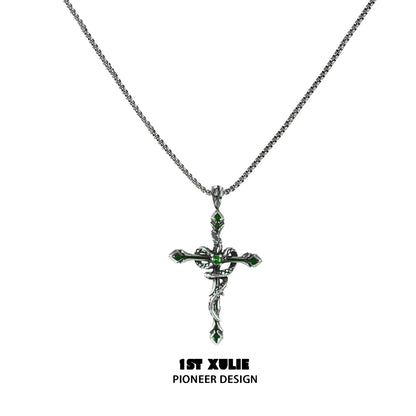 Gothic snake necklace with intricate cross design and green gemstone accents by 1STXULIE