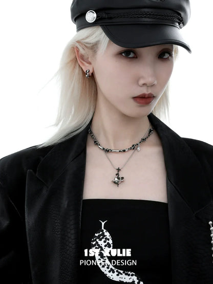Stylish model wearing a gothic snake necklace with silver accents and dark attire