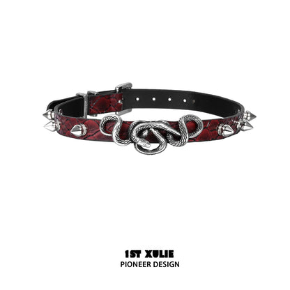 Gothic snake necklace featuring a silver snake pendant on a textured red belt with spikes