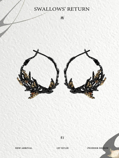 Gothic swallow earrings with intricate black design and golden accents for a unique look