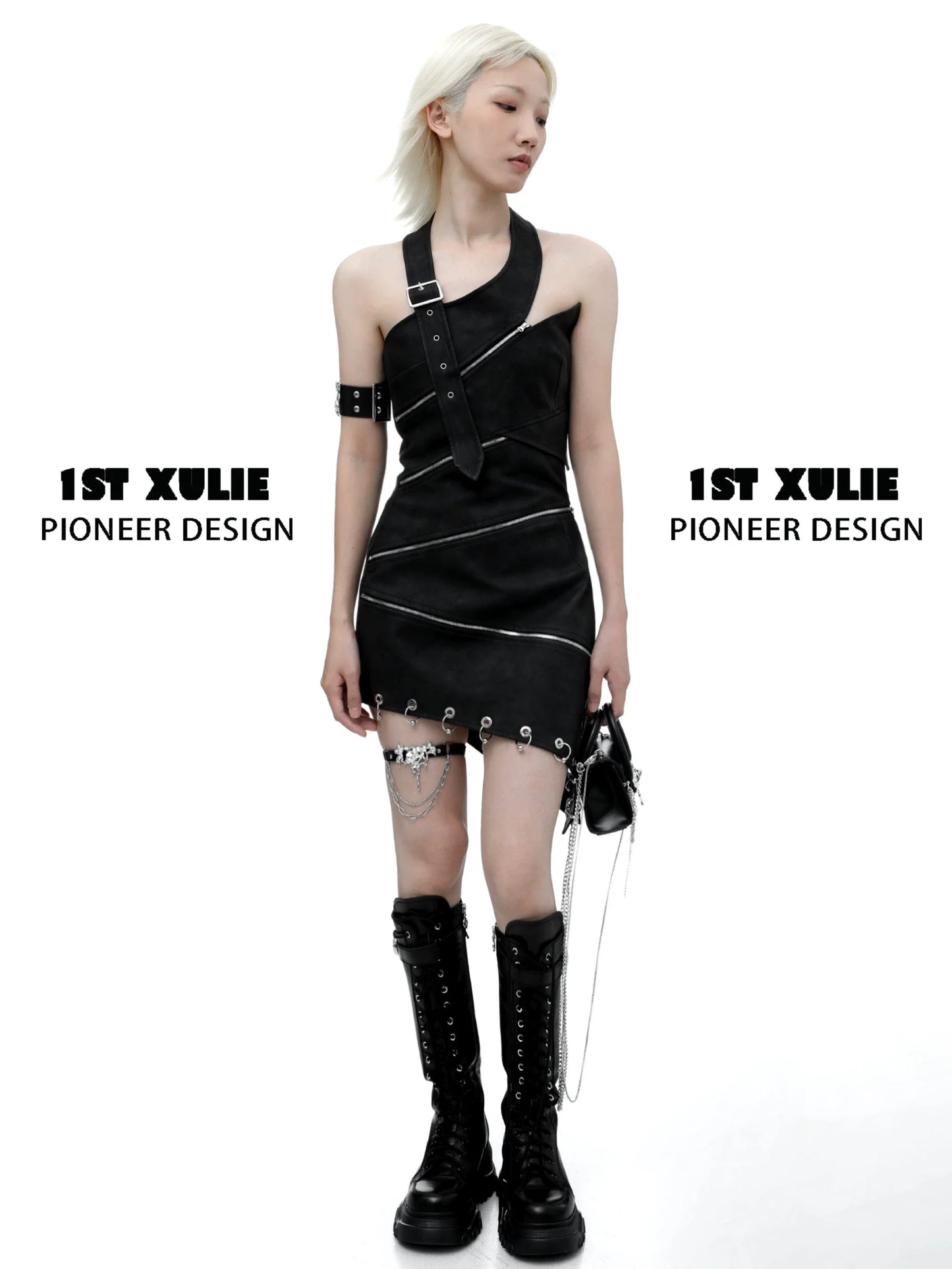 Model wearing black dress with gothic thigh chain jewelry and combat boots for a bold fashion look