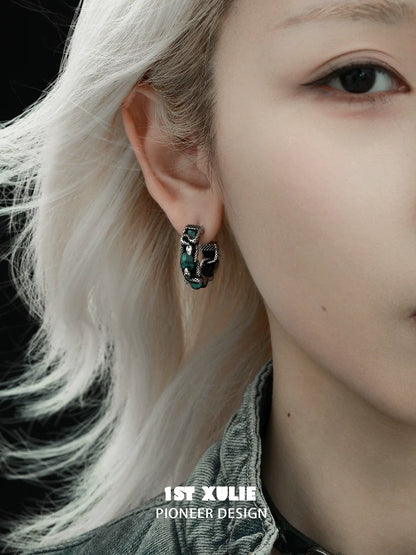 Stylish Gothic Venomous Spirit Earrings displayed on a model showcasing their unique design