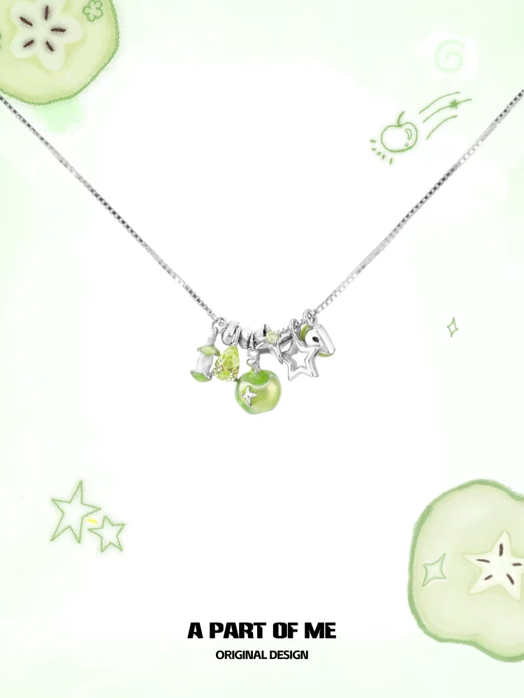 A silver chain necklace featuring a green apple star necklace design with colorful charms