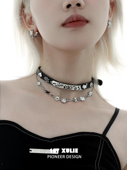 Stylish model wearing a happy puppy black leather necklace paired with matching earrings
