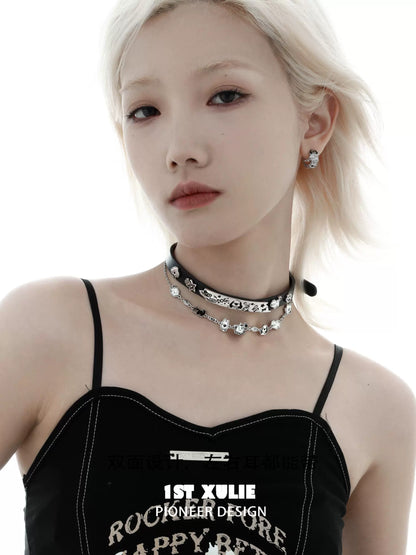 Stylish model wearing a happy puppy black leather necklace with unique charms