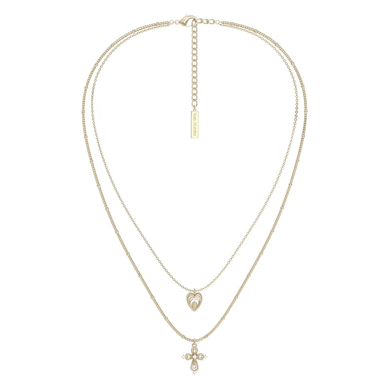Heart cross double layer necklace from SUN HUNTER featuring elegant gold chains and unique charms