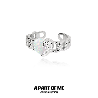 A PART OF ME heart vow ring in silver featuring an iridescent heart design