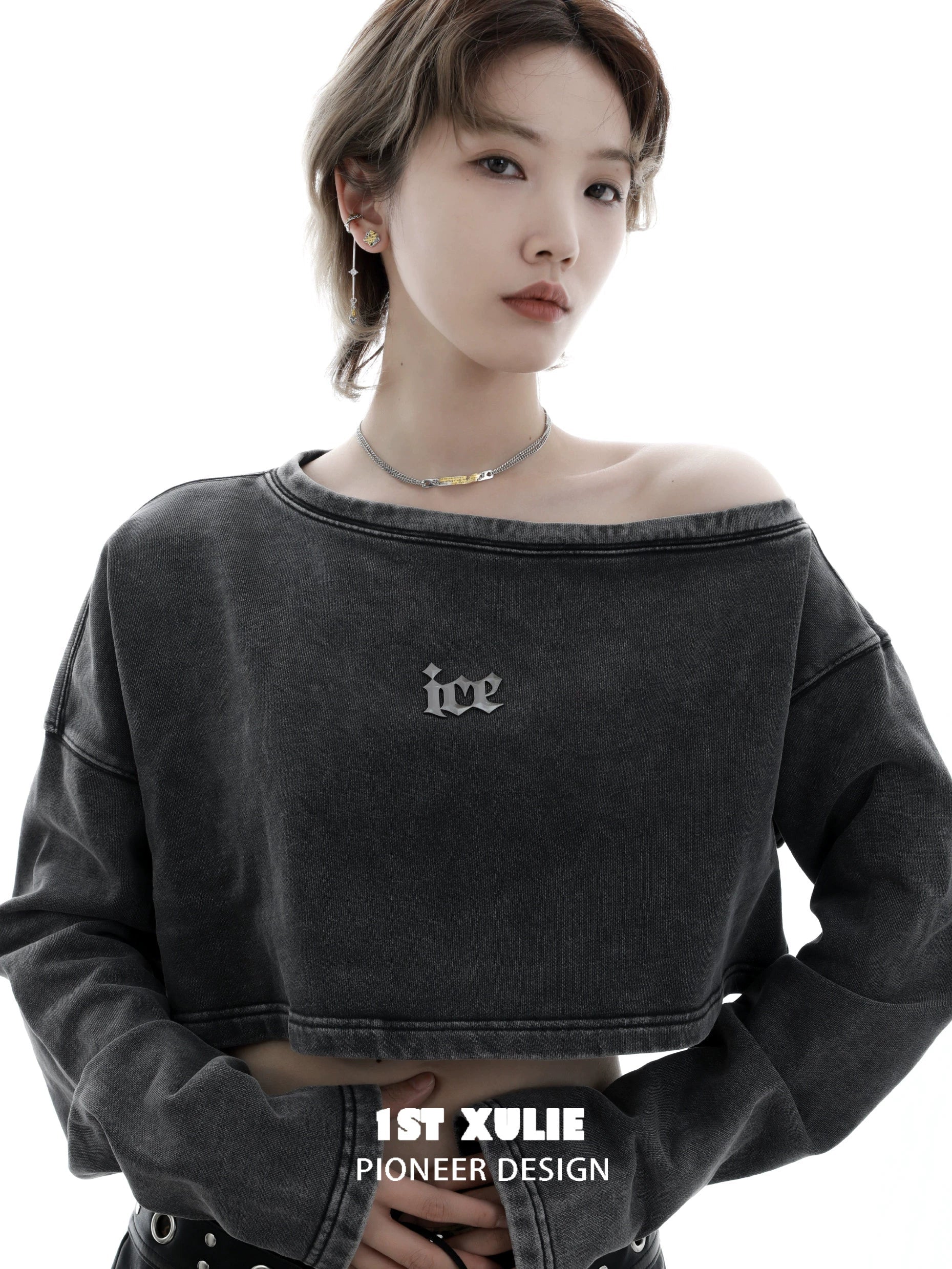 Model wearing 1STXULIE ice cropped sweatshirt with the immortal bond couple necklace showcased