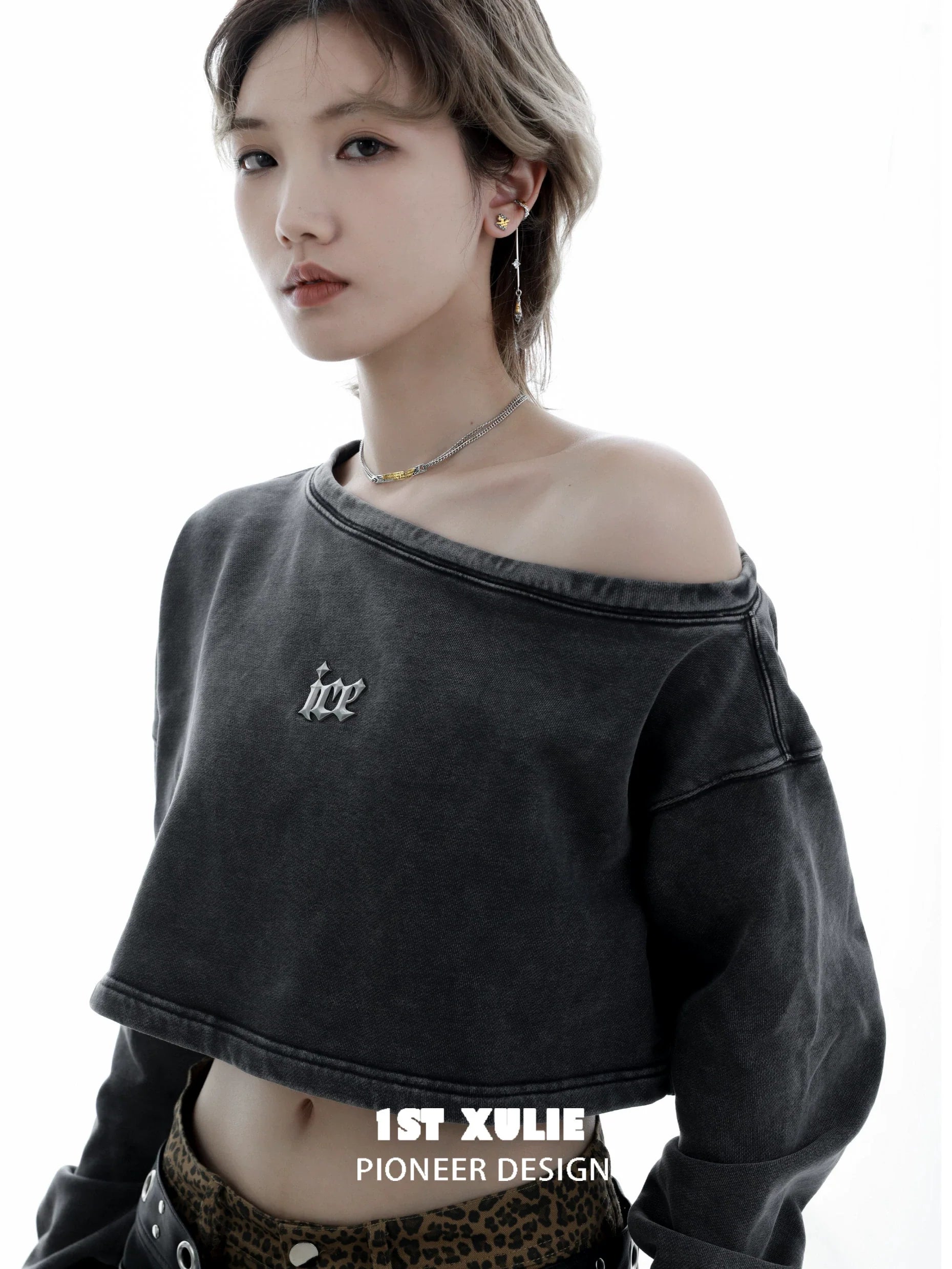 Model wearing a stylish off-shoulder crop top featuring the immortal bond couple necklace for trendy appeal