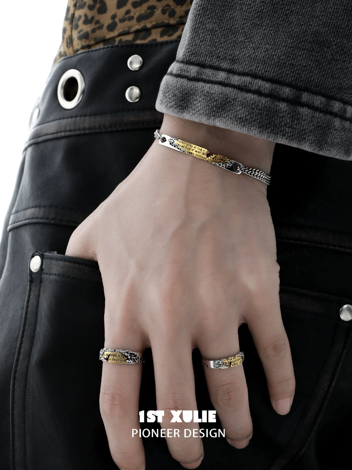 Stylish immortal love letter couple bracelet shown on a model's hand with casual attire
