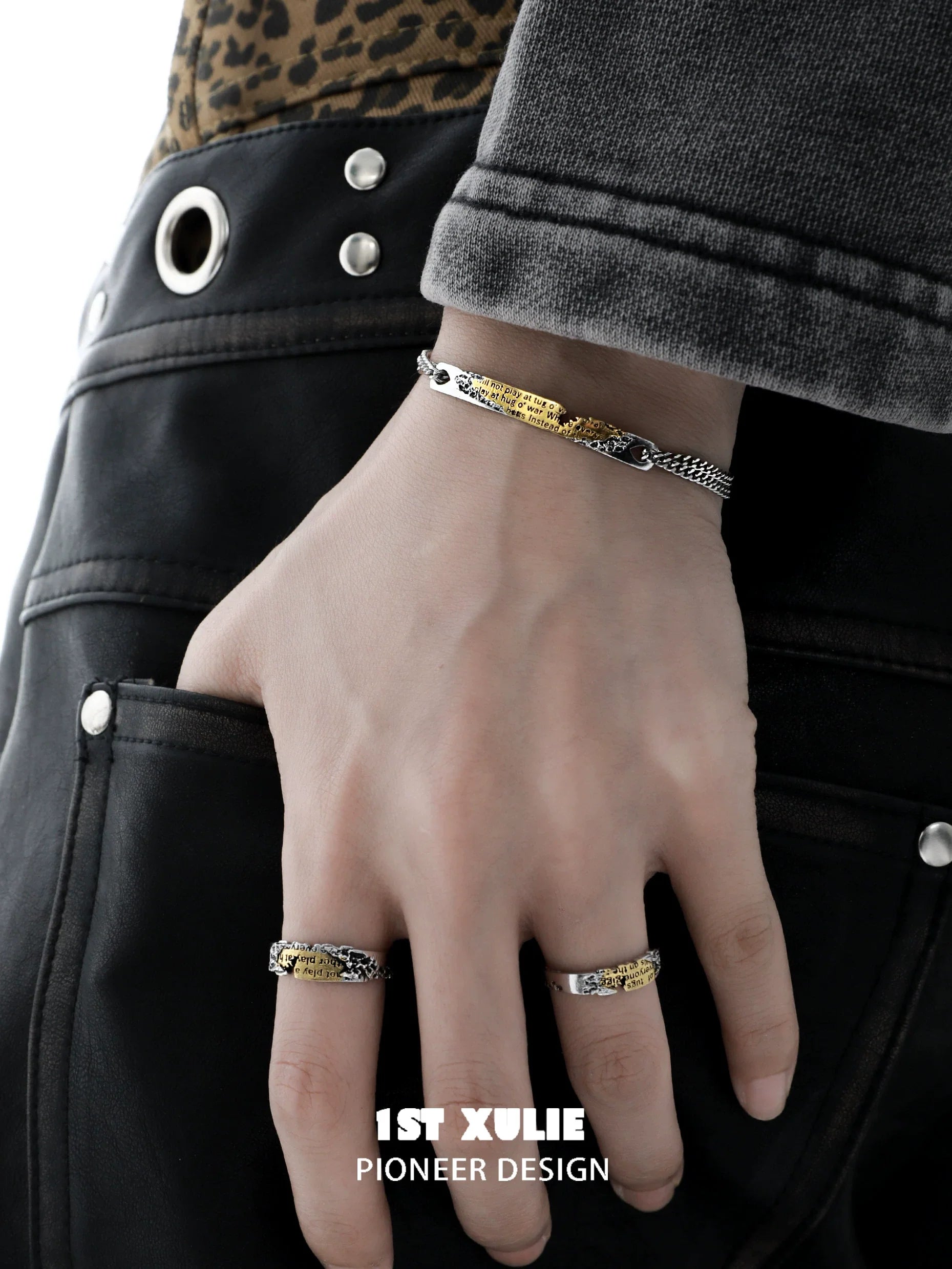 Stylish immortal love letter couple bracelet shown on a model's hand with casual attire