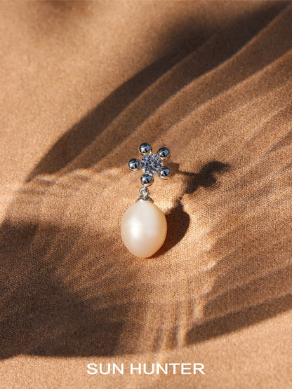 Elegant island flower pearl earrings featuring a floral design with a shimmering pearl drop