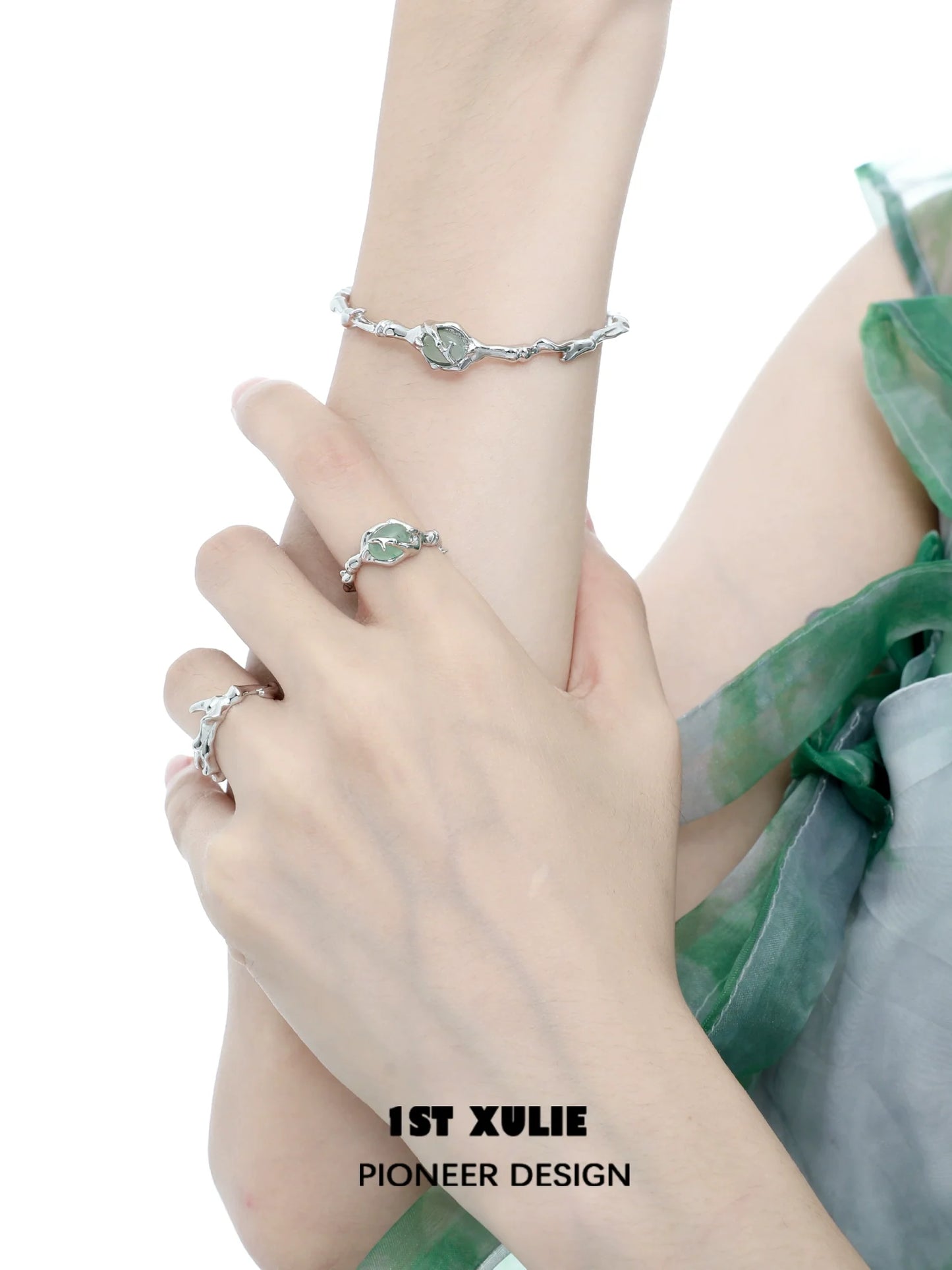 Jade bamboo silver bracelet elegantly displayed on a model's wrist with a matching ring