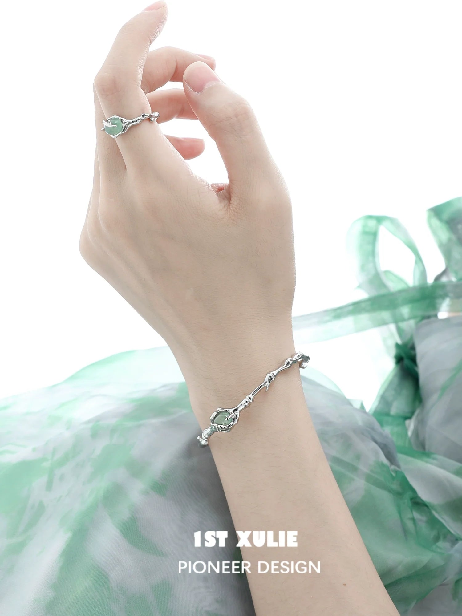 Elegant jade bamboo silver bracelet by 1STXULIE featuring a unique design with green jade accents