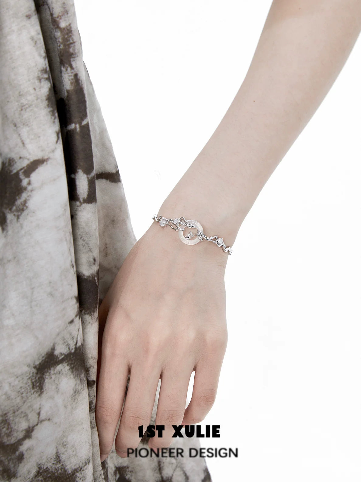 Elegant jade rabbit white agate silver bracelet showcased on a model's wrist