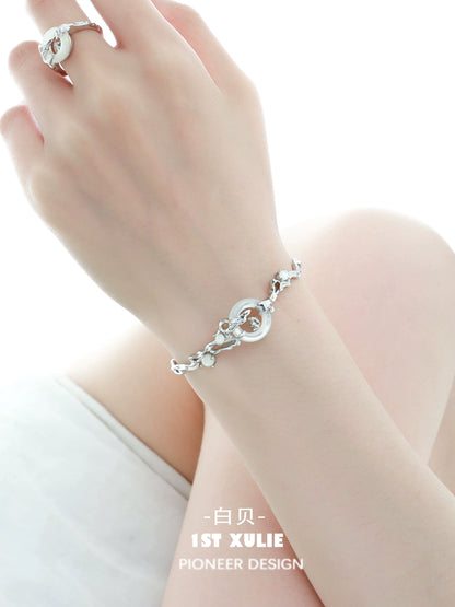 Jade Rabbit white agate silver bracelet displayed elegantly on a hand with delicate design and shine