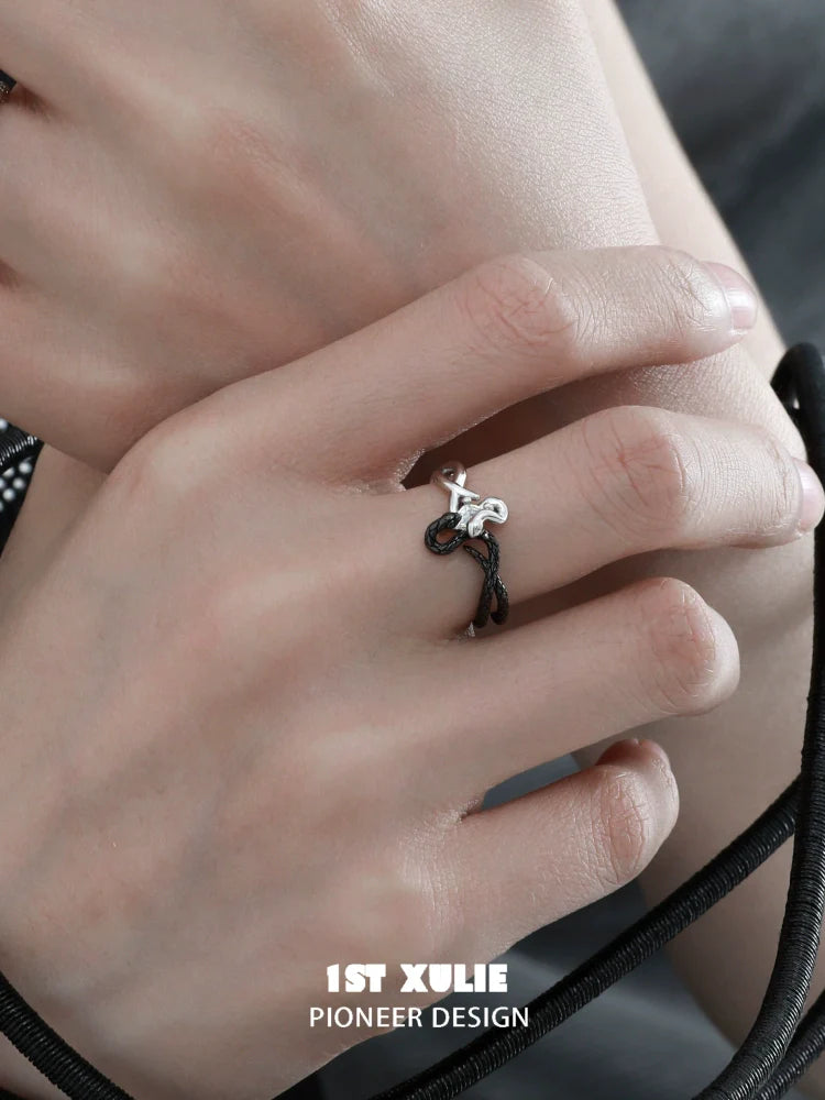 Stylish black and white snake ring designed by 1STXULIE, showcasing a unique minimalist look