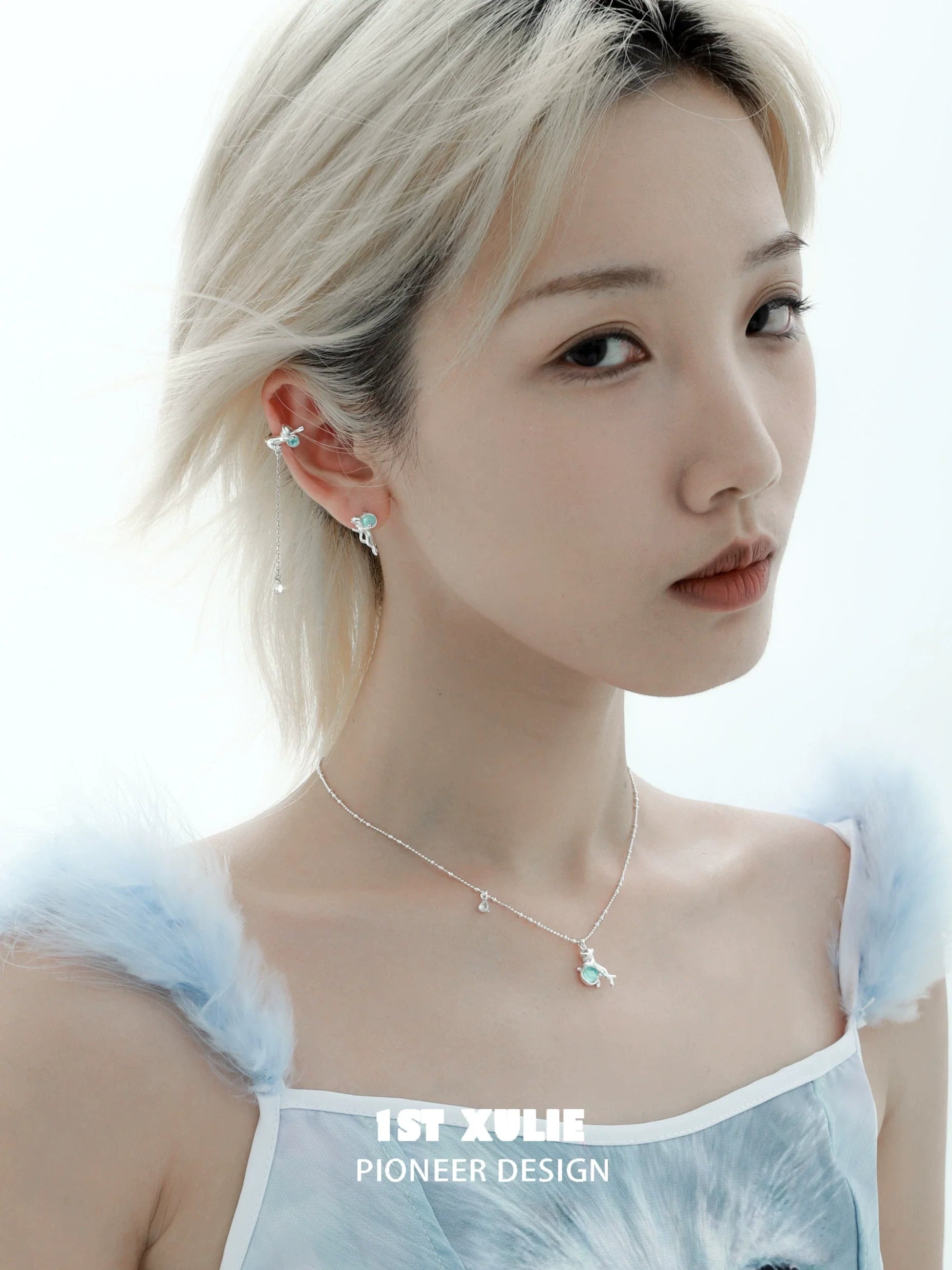 Stylish model wearing 1STXULIE kitten ear cuff jewelry with delicate designs and pastel accents