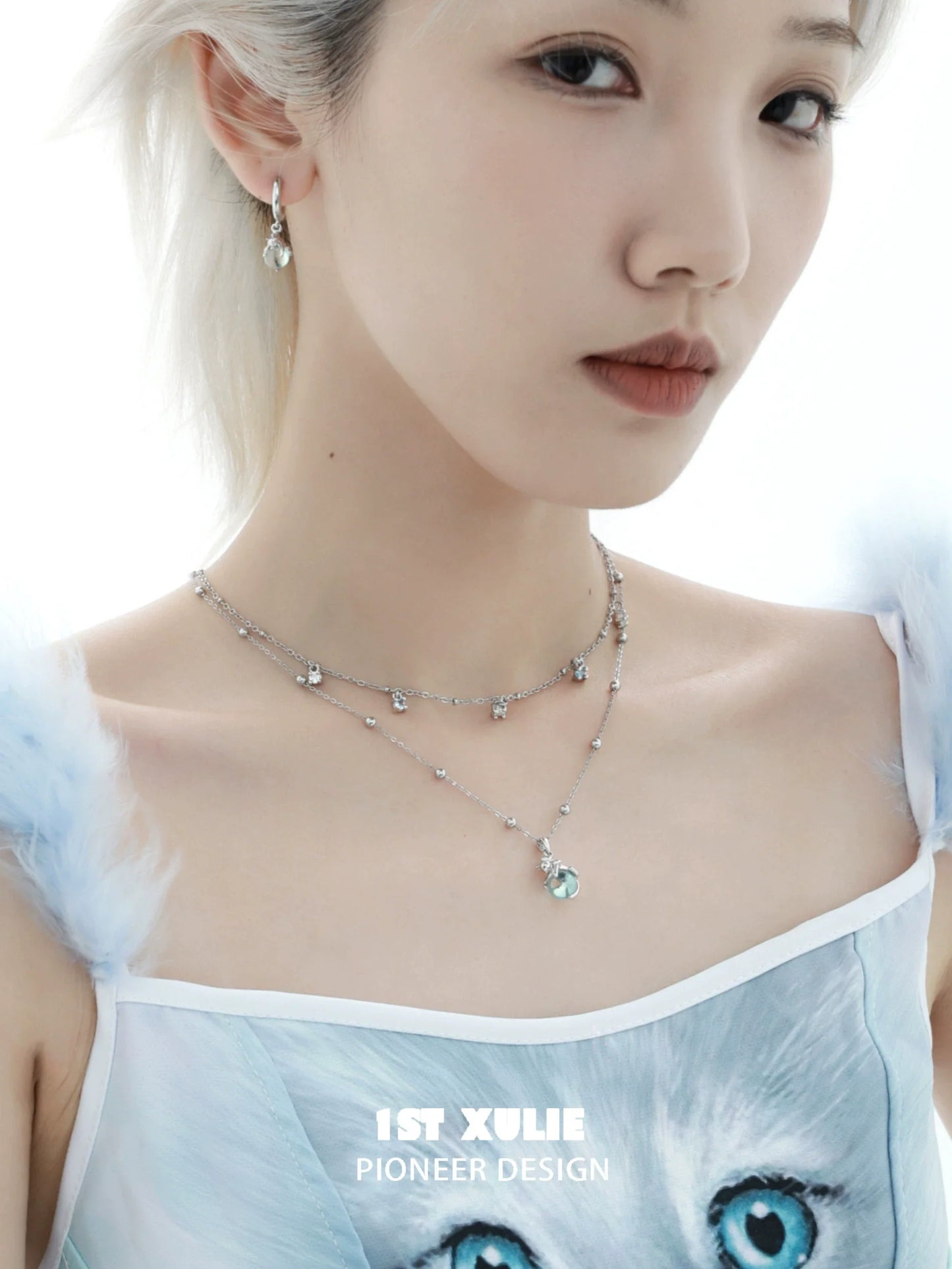 Stylish kitten necklace for summer featuring sparkling charms and layered design, perfect for trendy outfits.