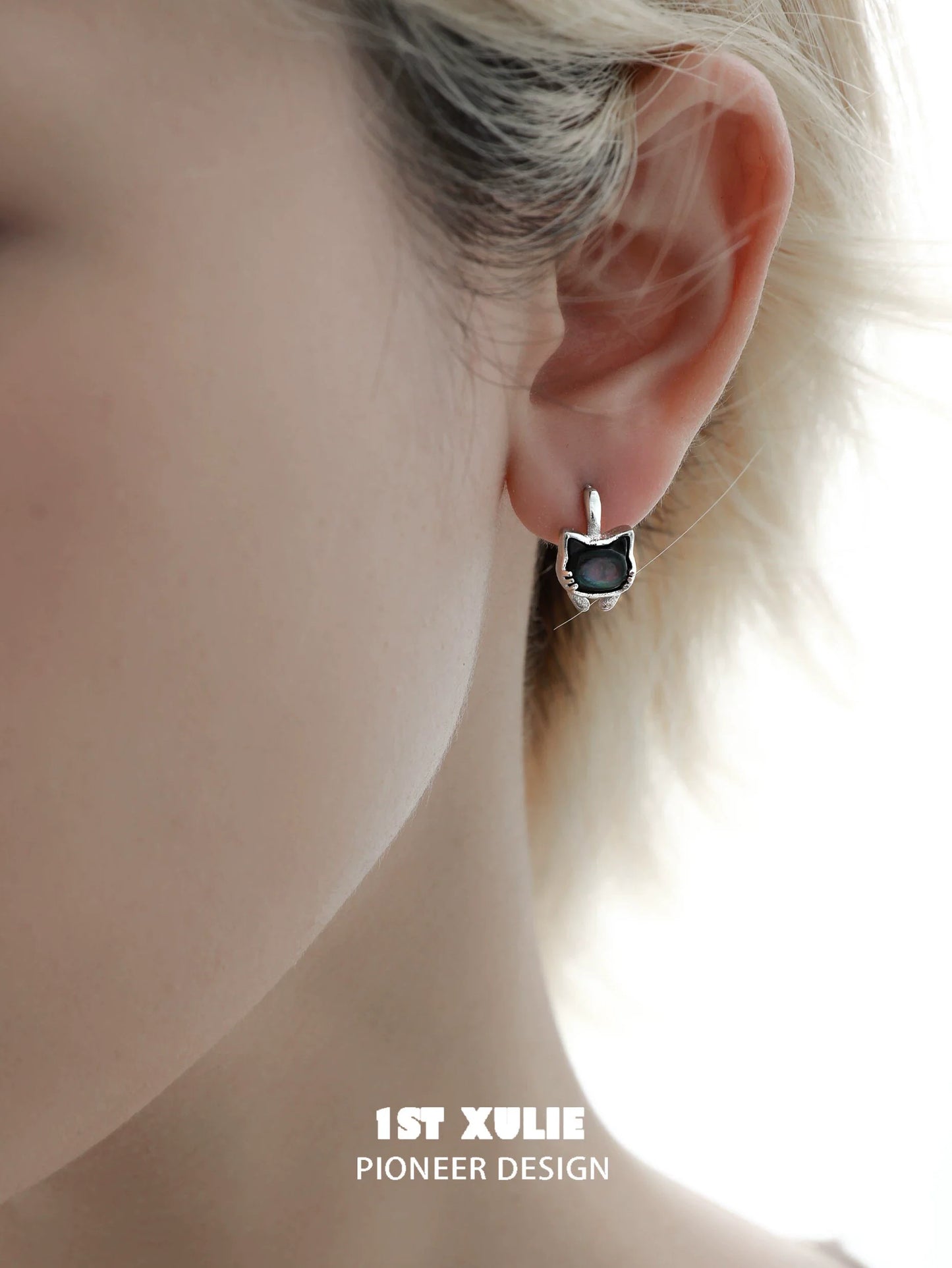 Silver kitten stud earrings featuring a cute cat face design for animal lovers