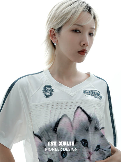 Model wearing 1STXULIE kitten stud earrings with a graphic cat shirt for a trendy look