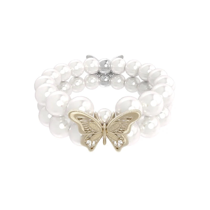 Lace butterfly pearl bracelet featuring a delicate gold butterfly charm and lustrous pearl beads