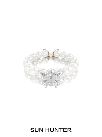 SUN HUNTER lace butterfly pearl bracelet featuring elegant pearls and a beautiful butterfly charm