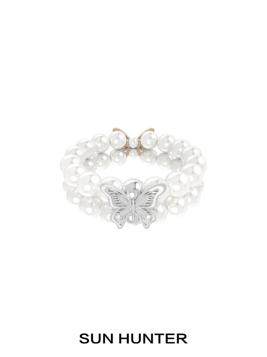 SUN HUNTER lace butterfly pearl bracelet featuring elegant pearls and a beautiful butterfly charm