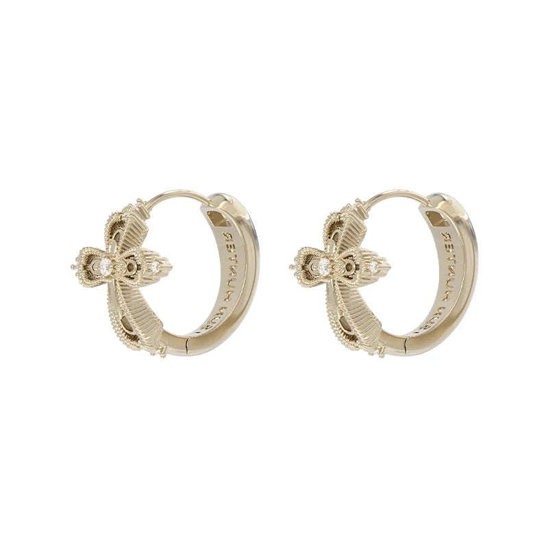 Elegant SUN HUNTER lace cross earrings in gold featuring intricate detailing and sparkling accents