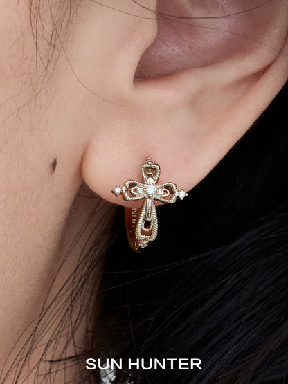 Unique SUN HUNTER lace cross earrings featuring intricate design and elegant details